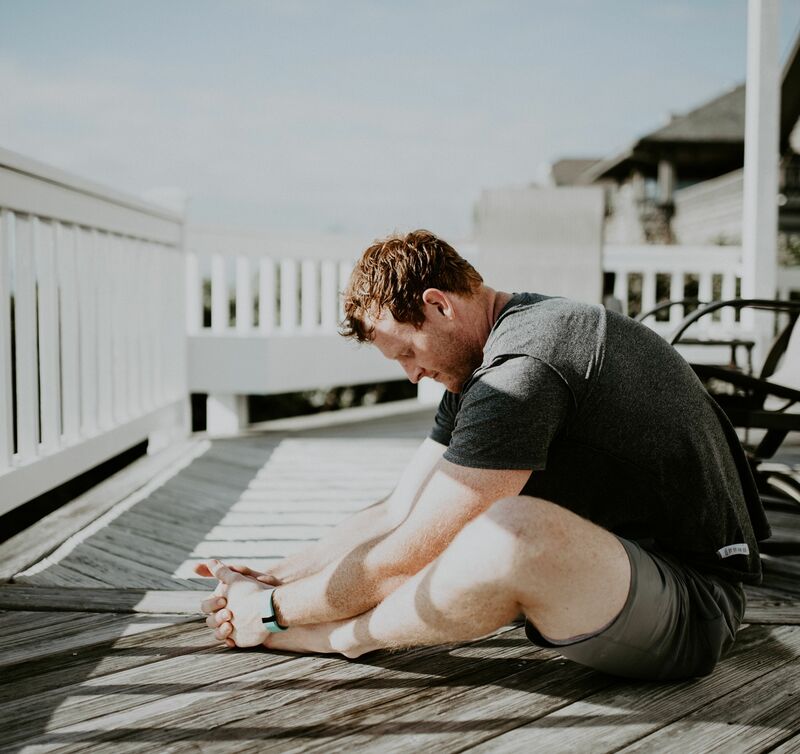 Man sitting stretching